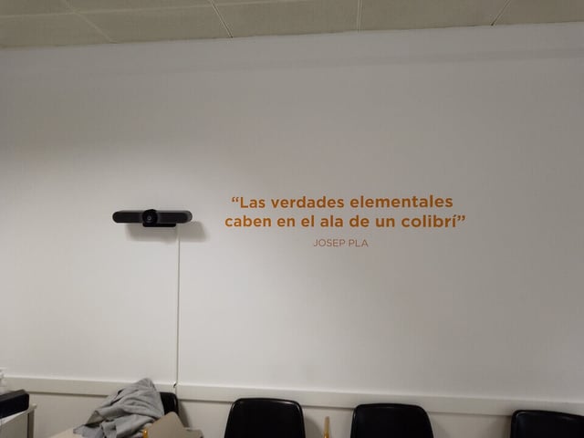 Spanish inscription on the wall of the CAPA Center that translates to “The Elemental Truths Fit on the Wing of a Hummingbird”