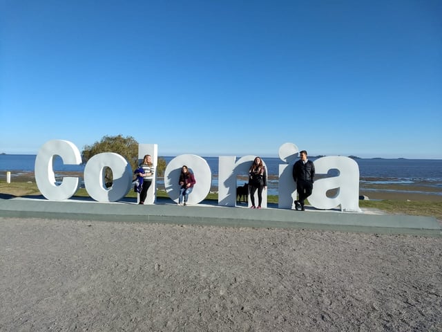 A Photo with Friends at the Colonia Sign