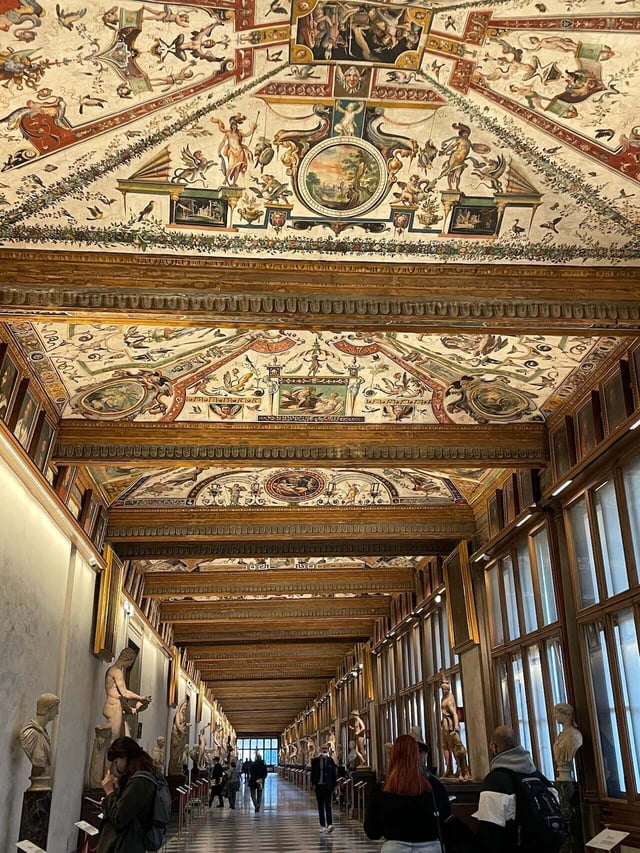 The indoor hall filled with art at the Uffizi Gallery in Florence, Italy