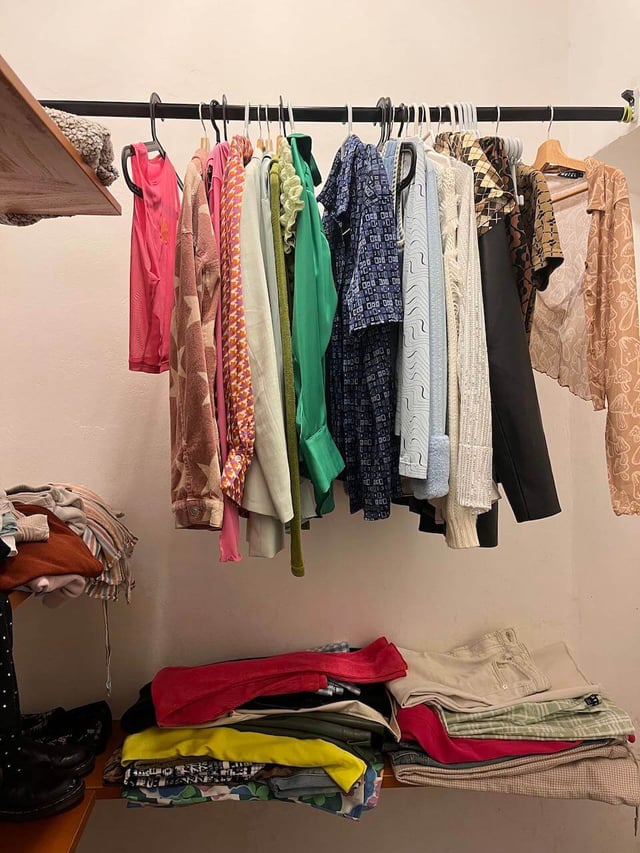 Clothes I brought hanging in the closet