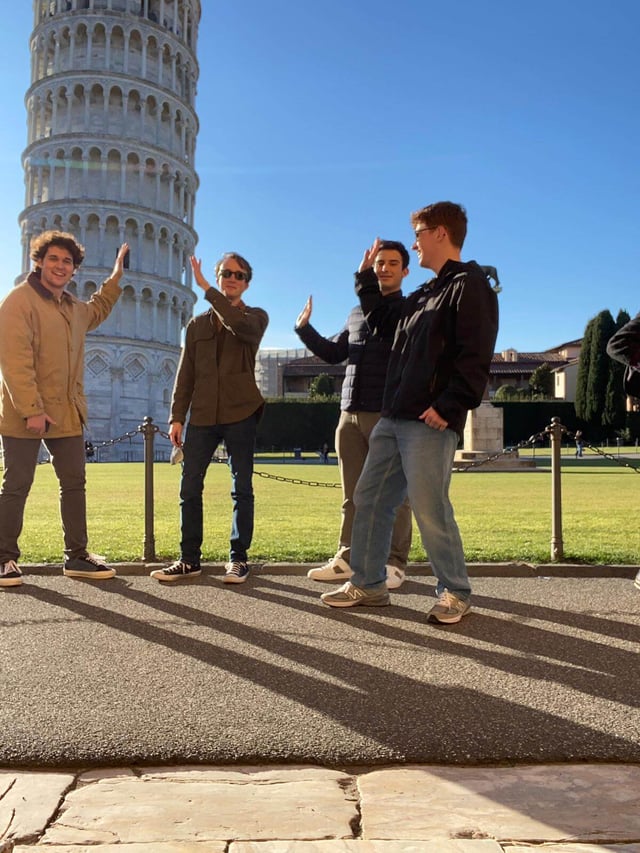 Posing at the leaning tower of Pisa with some friends
