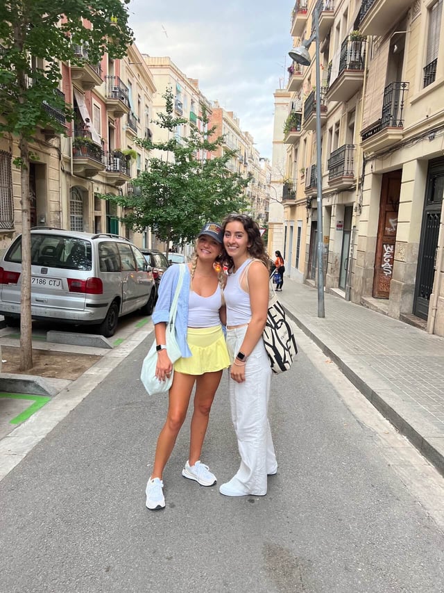 Taylor posing with a friend in a neighborhood in Barcelona