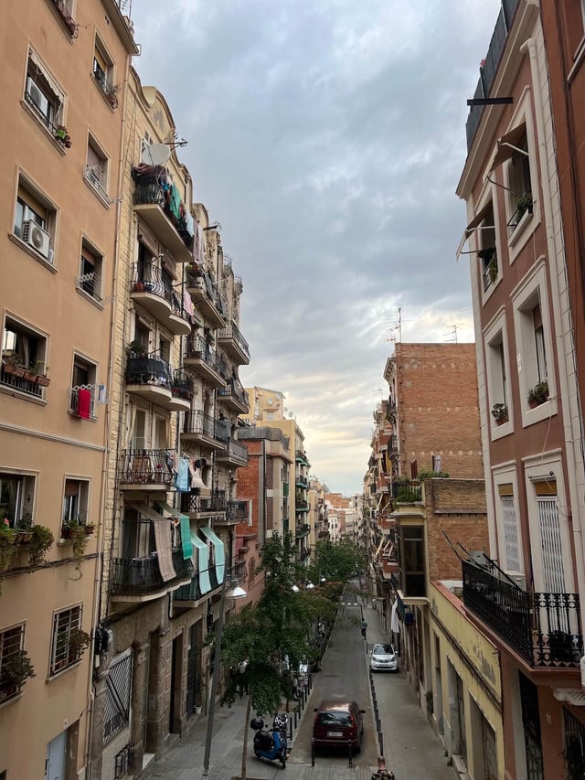 CAPAStudyAbroad_Summer2022_Barcelona_TaylorAtkinson_a street through apartment buildings in Barcelona