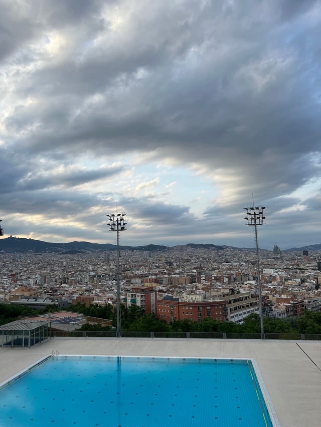 overlooking a pool and the cityscape of Barcelona