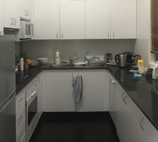 The smaller, enclosed kitchen