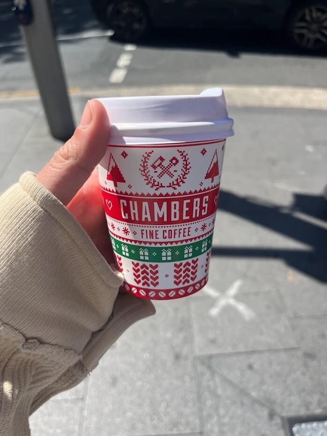 Christmas-decorated coffee cup from a local coffee shop