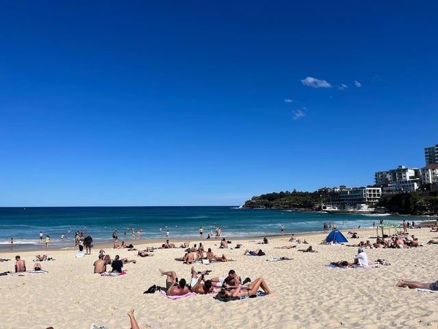 People enjoying Manly Beach on a sunny day in Sydney, Australia