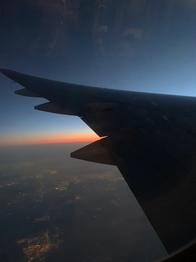 evening view of the sky with the plane's wing