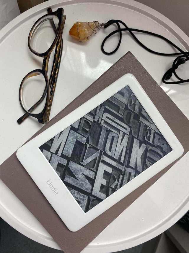 Kindle on a white table
