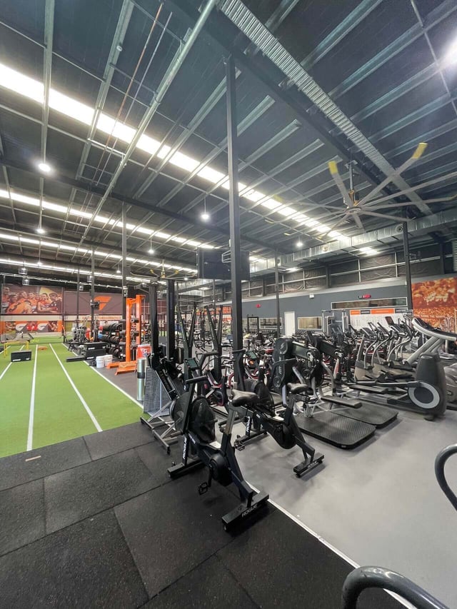 An indoor gym with an assortment of equipment around